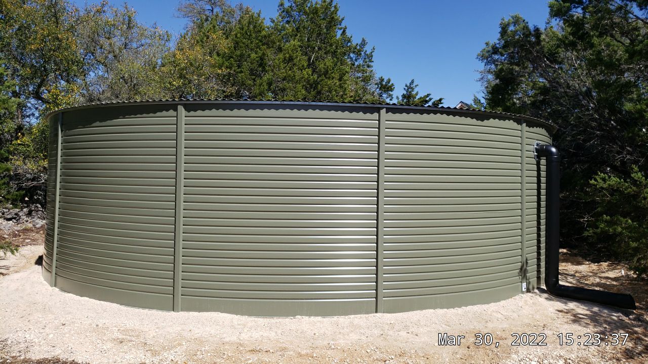 30K gallon mangrove green tank for residential rain water harvesting, Dripping Springs, TX by Hill Country Rain Water