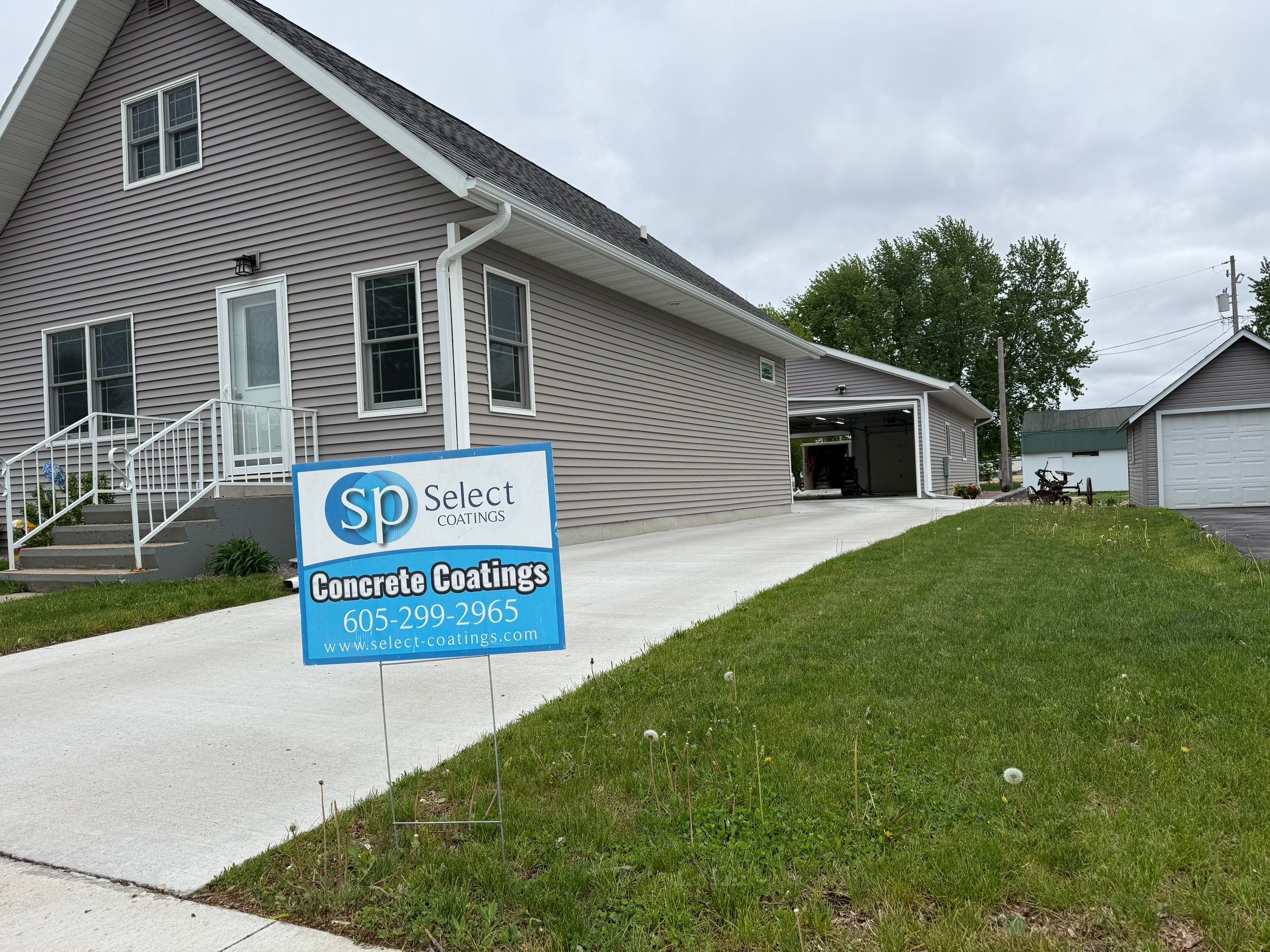 Speckled Epoxy Concrete Coating for Edgerton Garage Floor by Select Painting, Coatings & Garage Cabinets