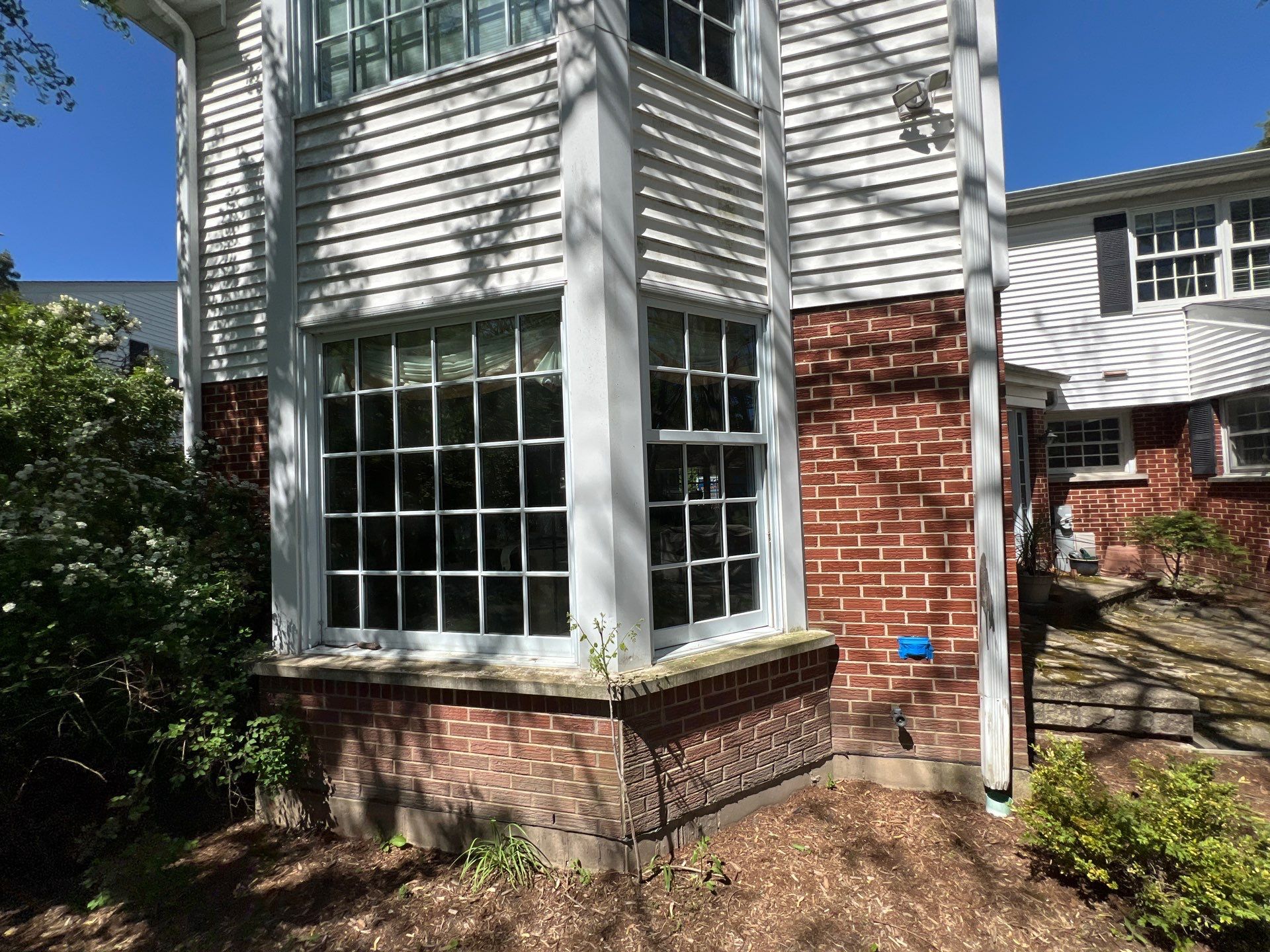 Housewashing  using Algaecide, soft wash soap by Northern Power Washing LLC.