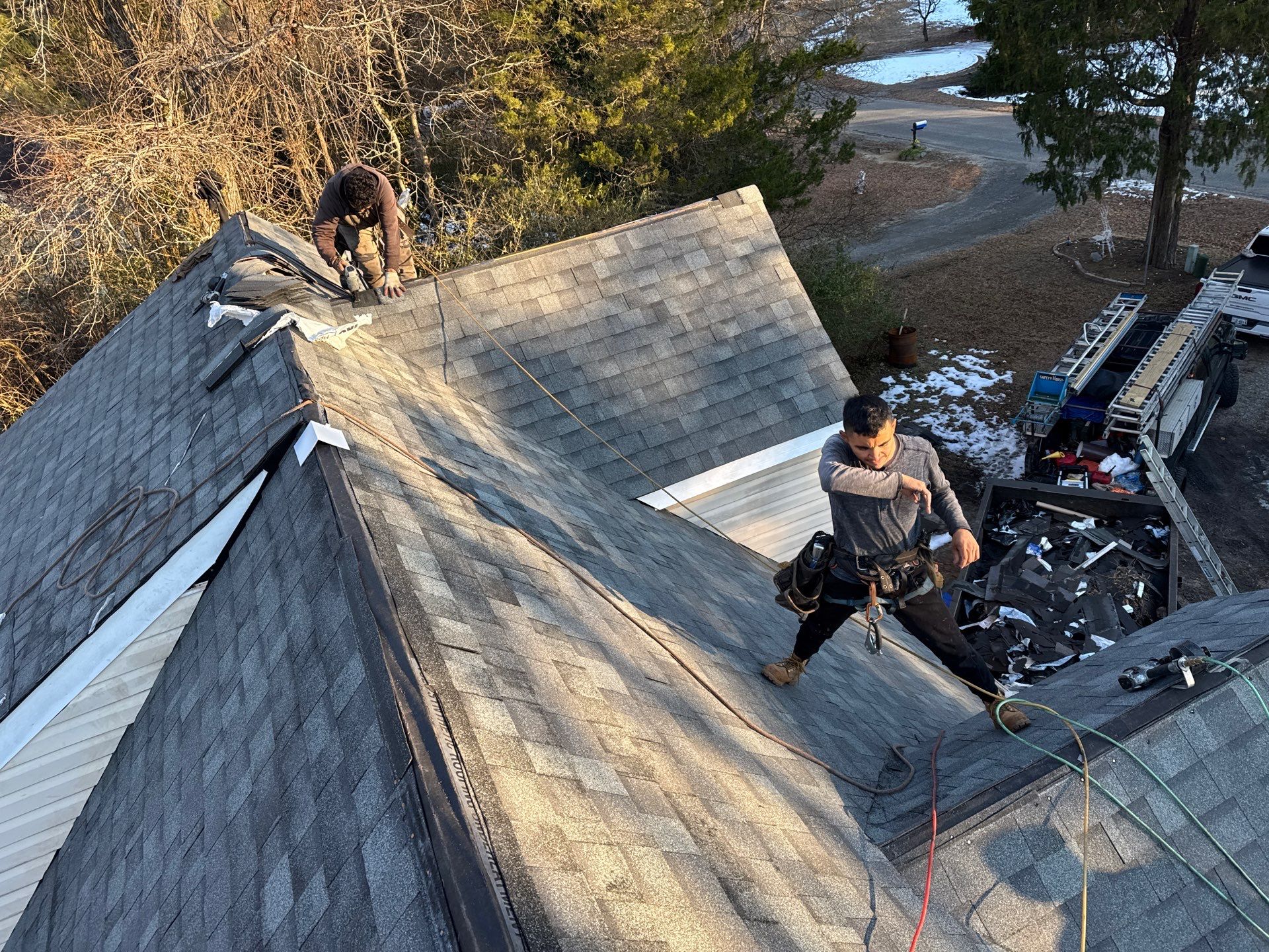 Gloucester Exterior Overhaul with Navy Blue Siding and New Roof by Cade Construction