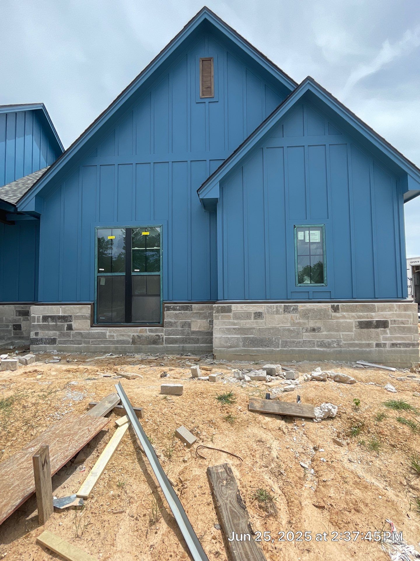 Natural Stone Elegance: Apex Installation Accented by Blue Siding by Apex Conventional Stucco Llc