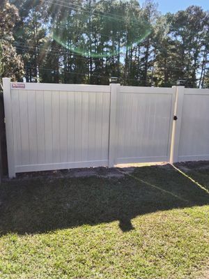 Custom Tan Vinyl Privacy Fence Installation with Double Gates in Winterville