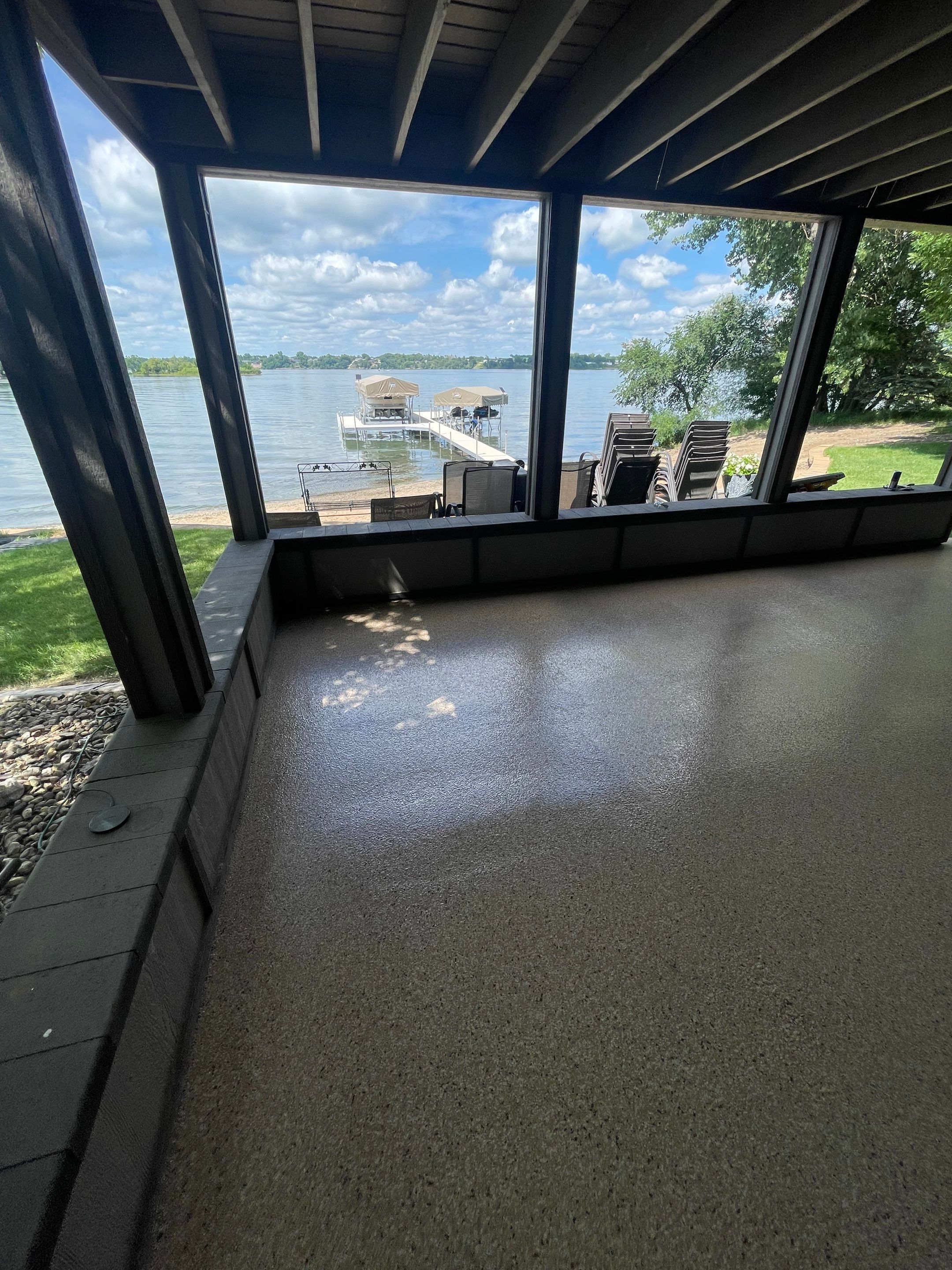 Lakefront Screened Patio Concrete Coating Installation in Wentworth by Select Painting, Coatings & Garage Cabinets