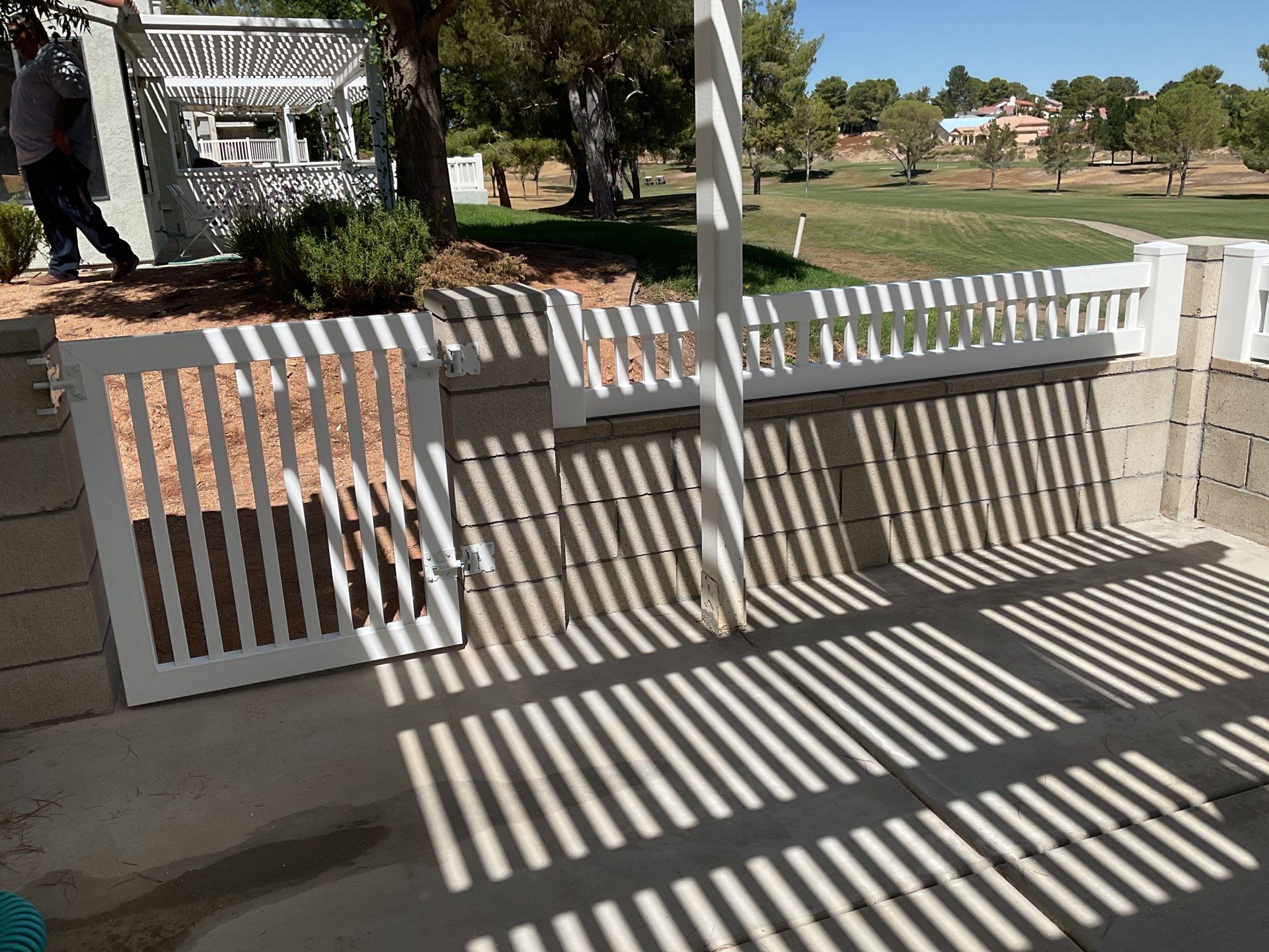 White Box Picket Fence on top of block wall  by Fence Guys Inc. 
