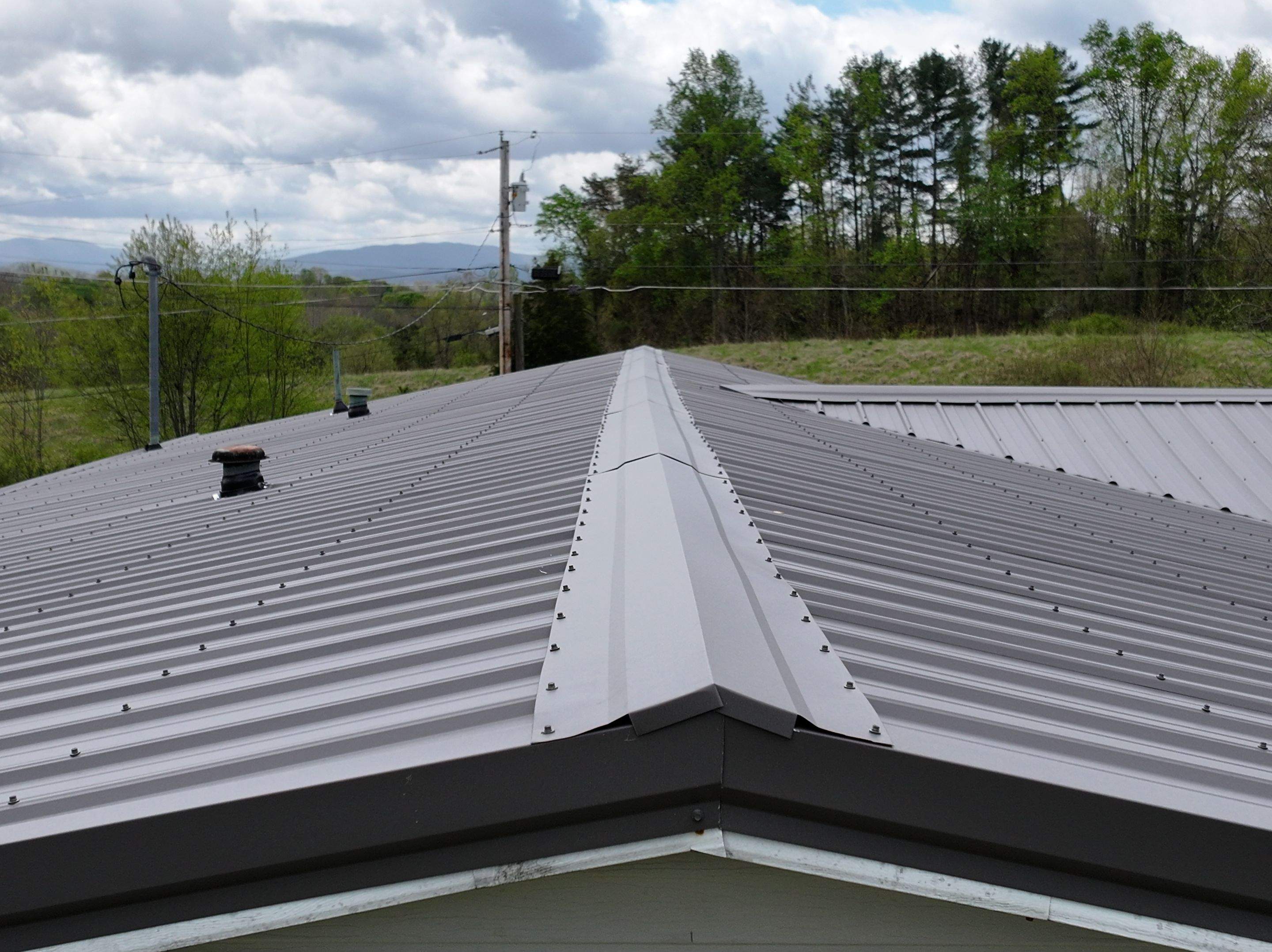 Charcoal Gray Textured Metal Roof by Omnia Roofing
