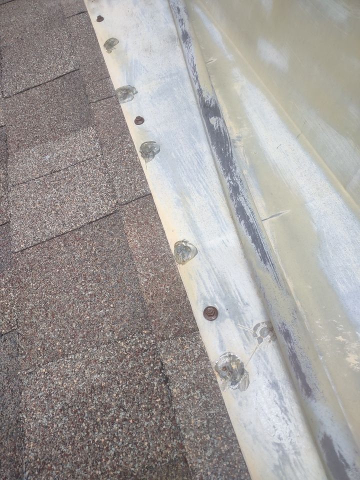 Roof Damage by Bros Roofing