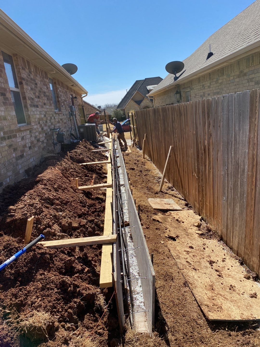 Concrete Slab , Retaining Wall , Fence, and landscape. by Clays Services Inc