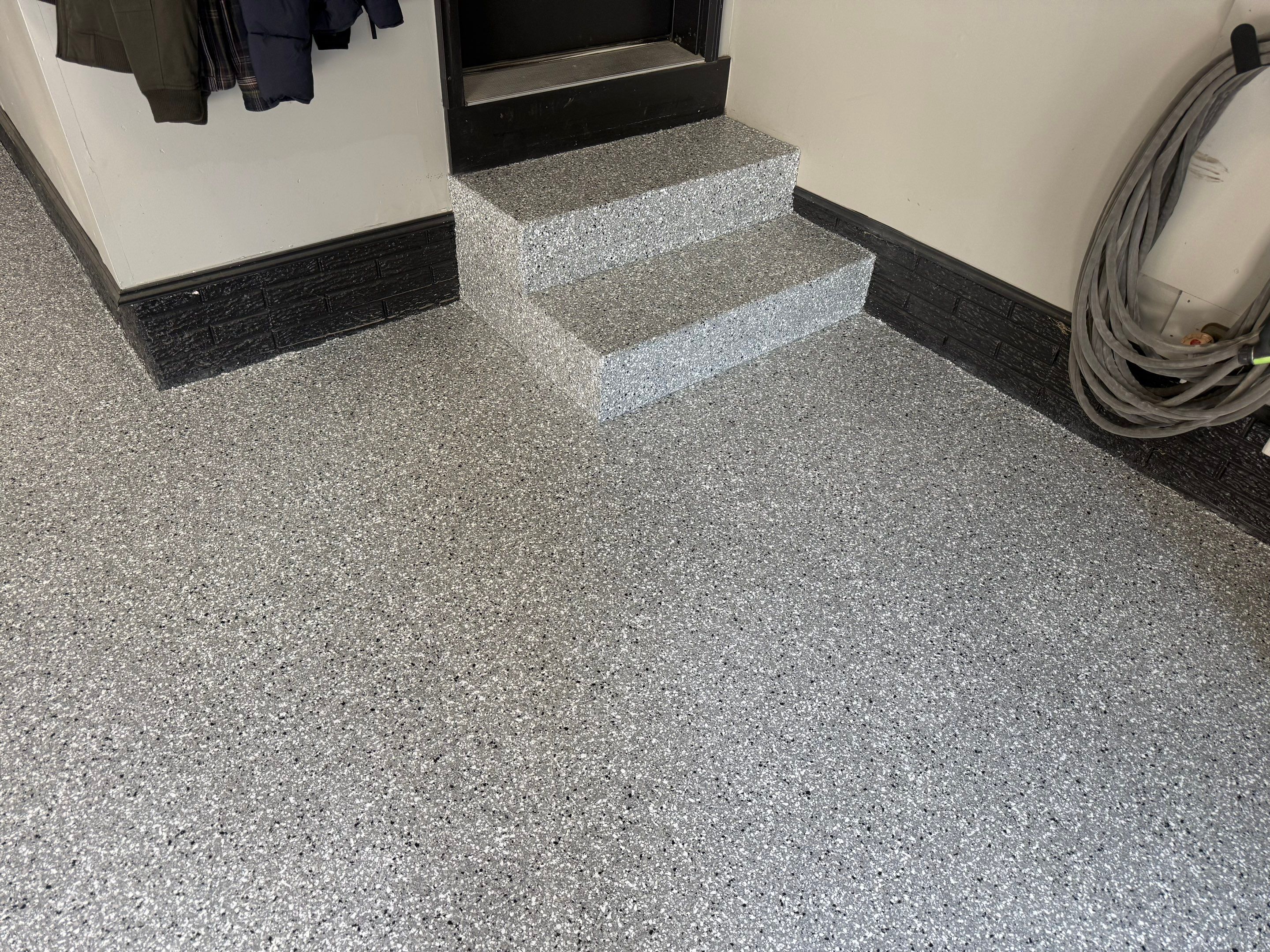 Garage Floor and Textured Pool Deck Coating in Sioux Falls by Select Painting, Coatings & Garage Cabinets