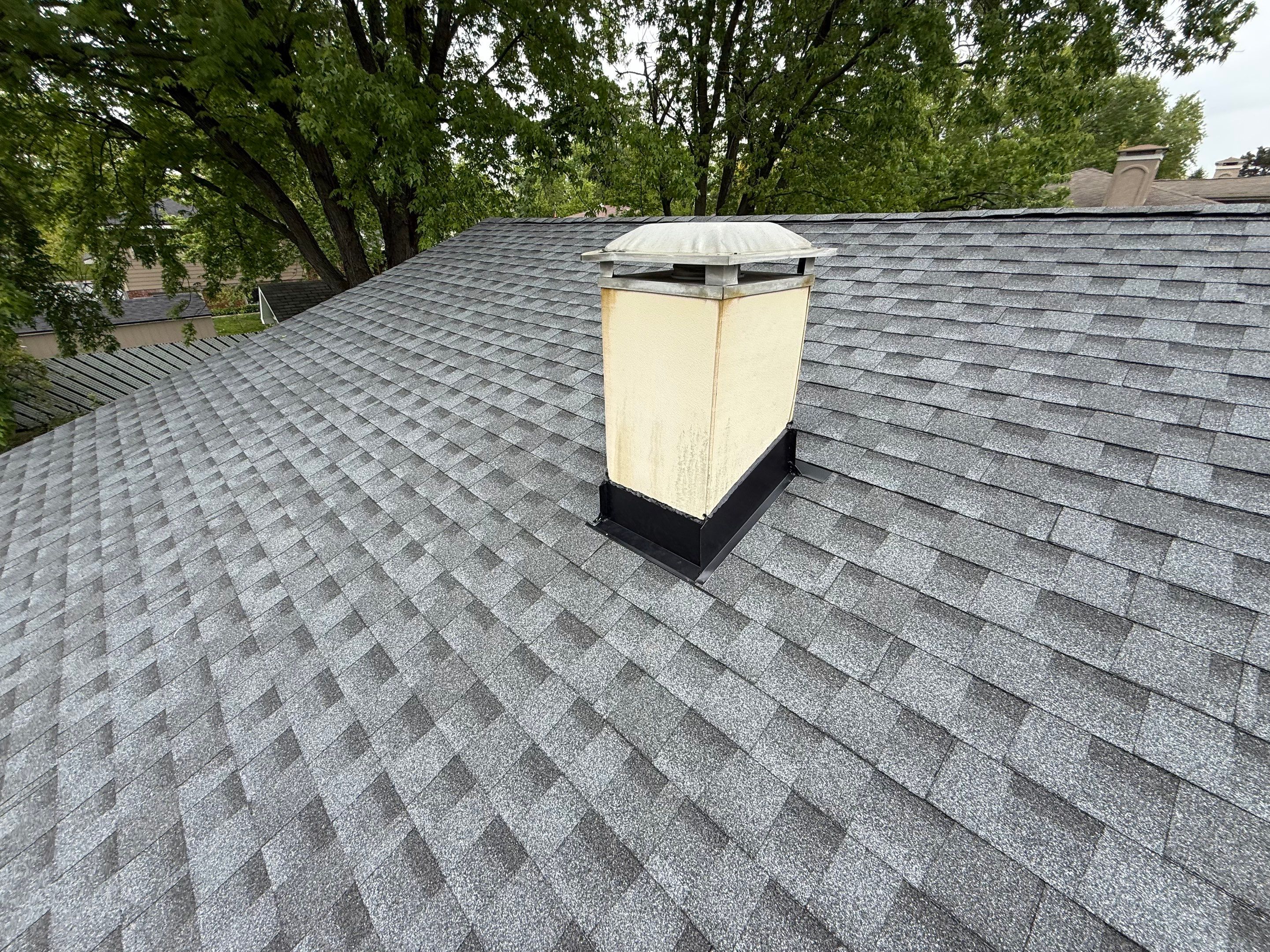 Roof replacement and chimney flashing by Optimal Home Improvement 