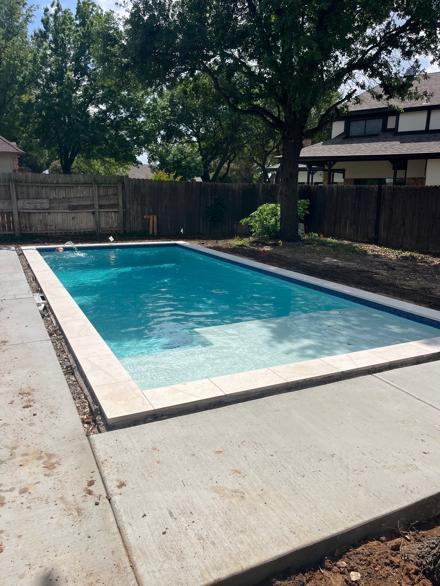 Modern Geometric Pool with Tanning Ledge by Pinnacle Pools and Spas - DFW