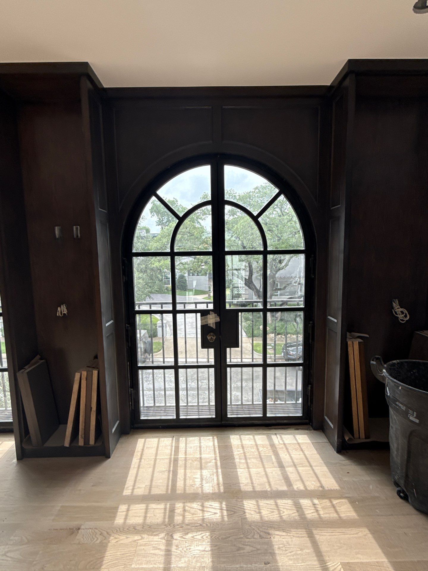 Arched Black Metal French Door Installation and Finishing in Fort Worth by Solara Custom Living