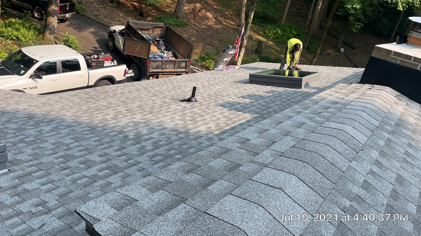 Deckhouse Roof Replacement by American Home Contractors