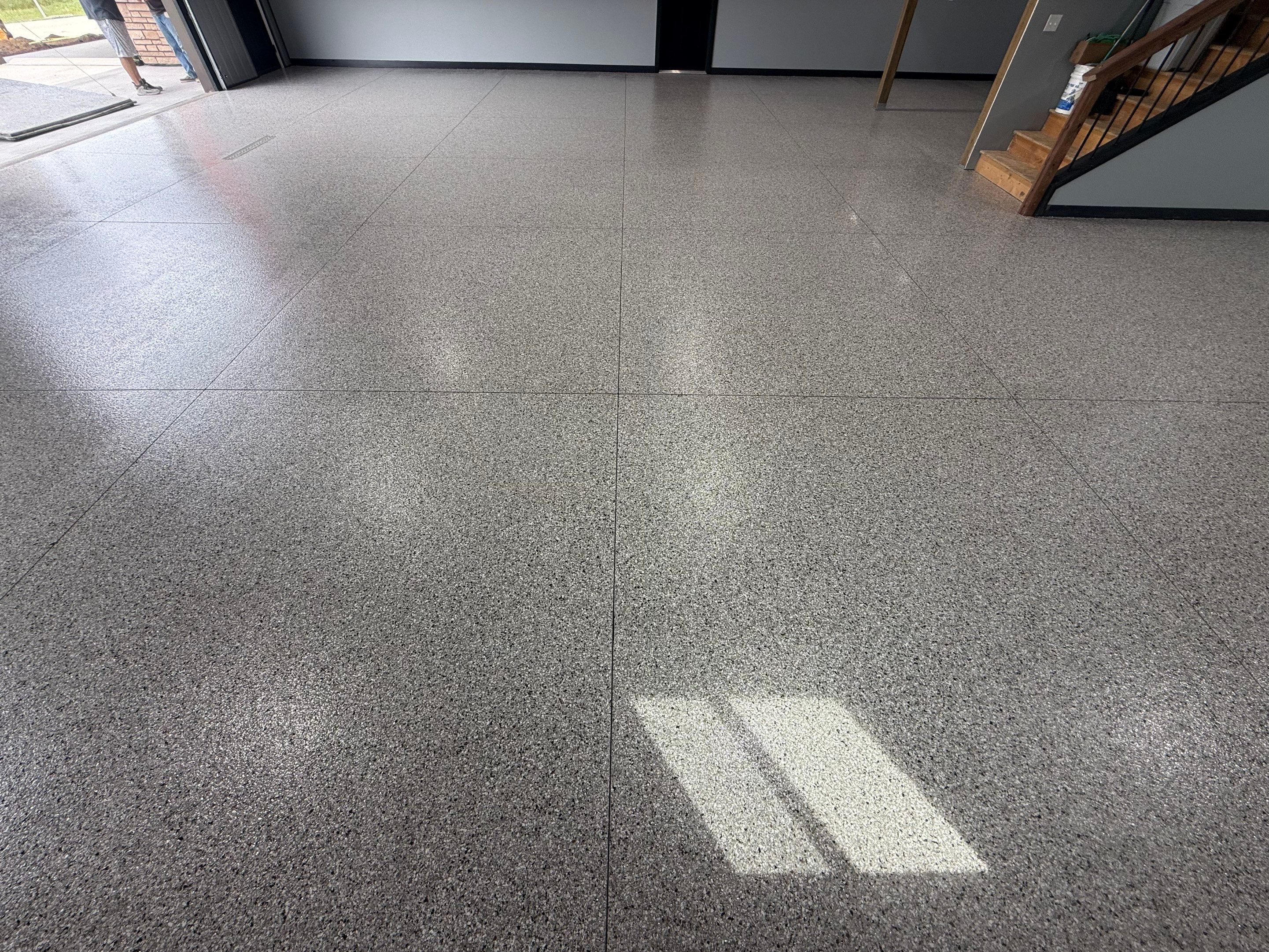 Polyaspartic Garage Floor Coating with Decorative Flake in Wentworth by Select Painting, Coatings & Garage Cabinets