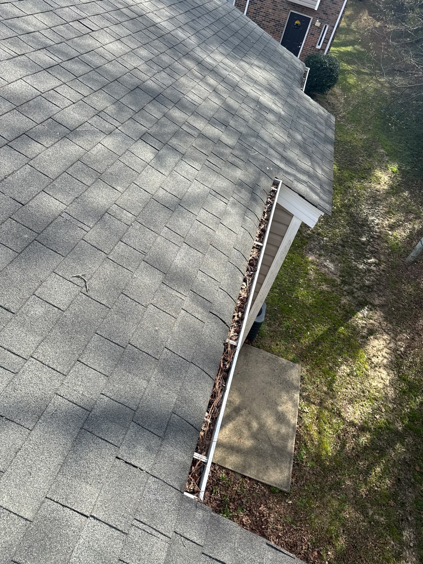 HOA gutter cleaning in Pinehurst & Southern Pines, NC,before photo showing full gutters.