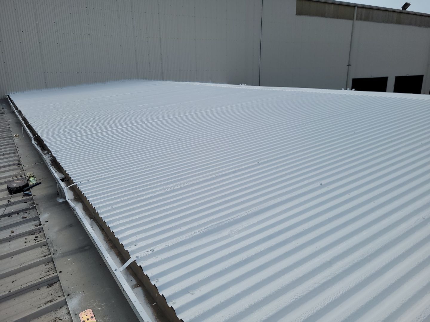 Commercial Metal Restoration System using Aldocoat Coatings by Hostetler Roofing