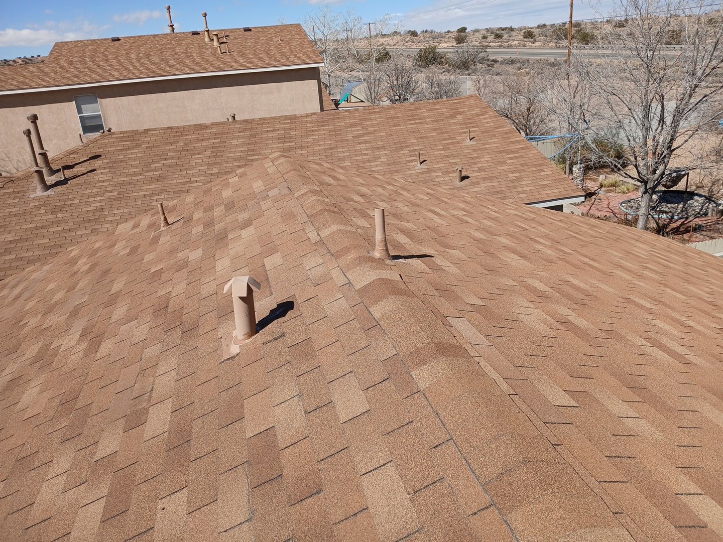 Wind damage repairs and maintenance in Rio Rancho by Doyle Roof Masters Inc