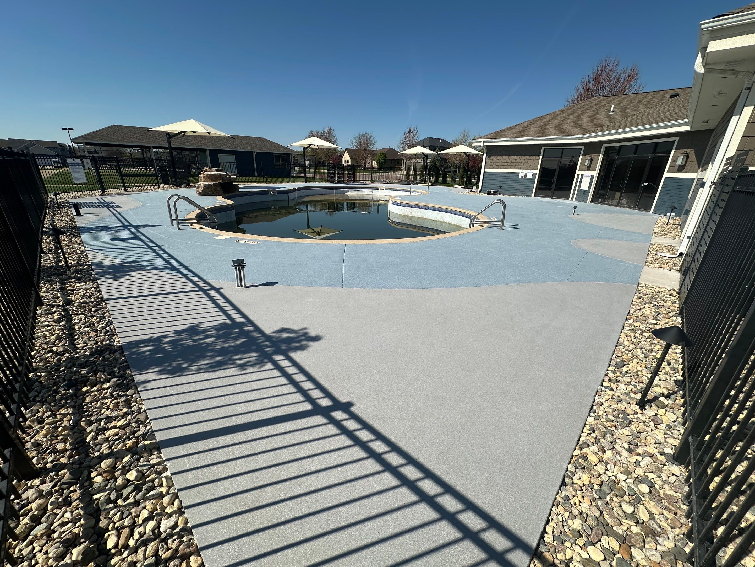 Arbors Edge Pool Deck Restoration and Textured Concrete Coating by Select Painting, Coatings & Garage Cabinets