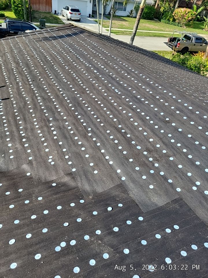 Residential Roofing Installation using 1" Nail strip metal roof by BLUES BROTHERS CONSTRUCTION CORP
