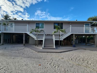 Elevated Home Deck Reconstruction With White Aluminum Railings in Placida