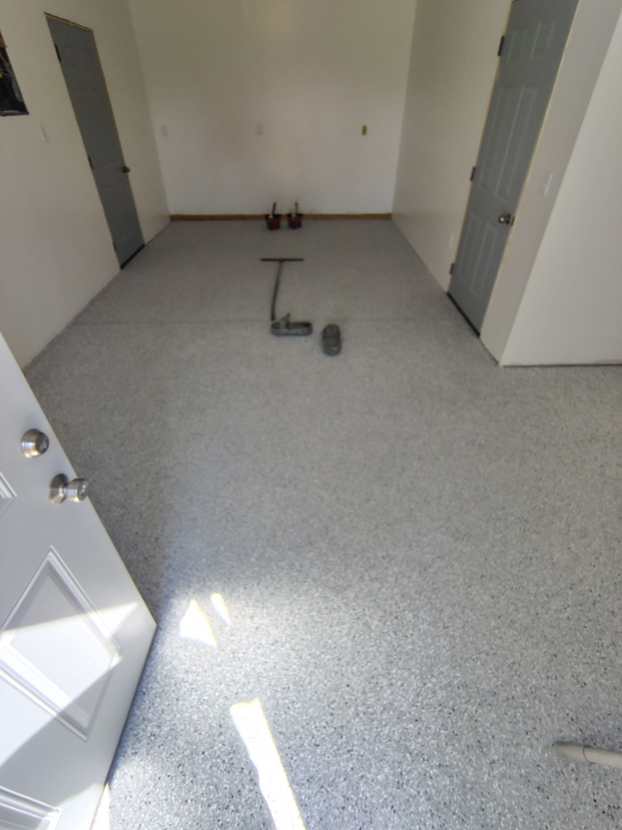 Decorative Chip Concrete Coating Installation in Luverne by Select Painting, Coatings & Garage Cabinets