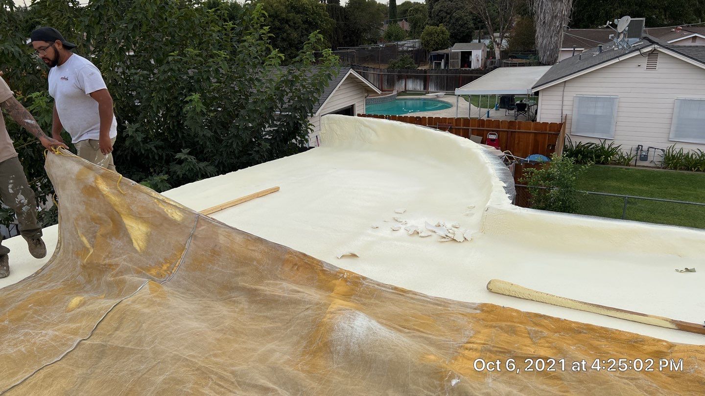 Residential Roofing Installation using Spray foam roofing insulation and General Coatings acrylic coatings by Straight Edge Roofing Inc