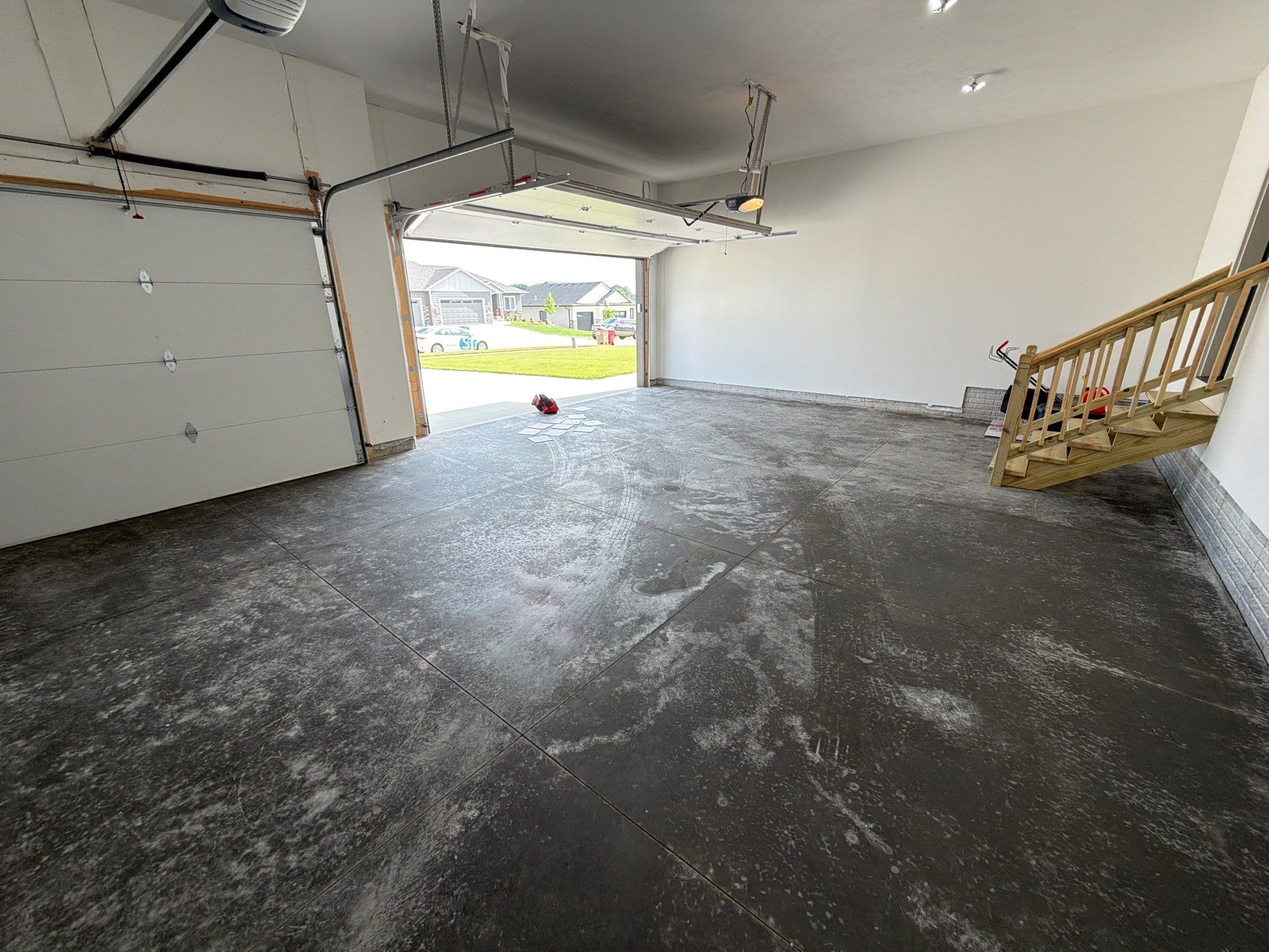 Cabin Fever Decorative Flake Garage Floor Coating in Sioux Falls by Select Painting, Coatings & Garage Cabinets