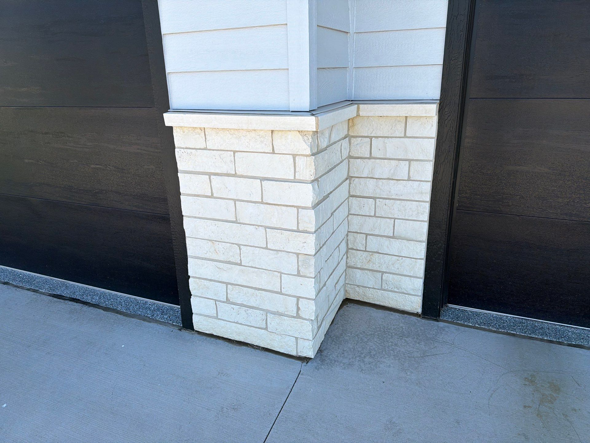 Modern Exterior Update with Siding and Stone Masonry in Sioux Falls by Select Painting, Coatings & Garage Cabinets