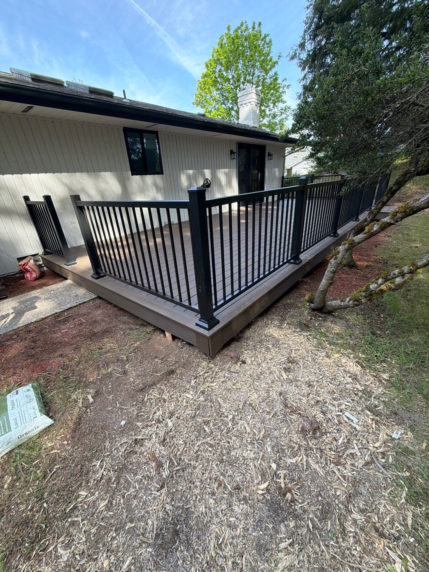 Renton Deck Transformation | TimberTech® Prime+ Dark Cocoa & Sea Salt Gray with Black Railing by Emerald City Energy