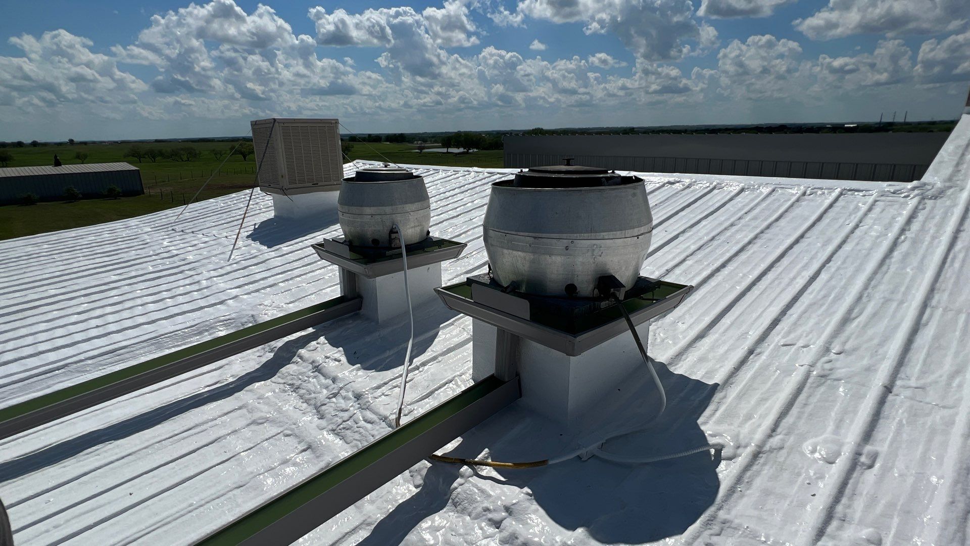 Commercial Roofing Repair using TRP #924 Eterna-Sil Premium Silicone Roof Coating by Harvey Roofing & Construction
