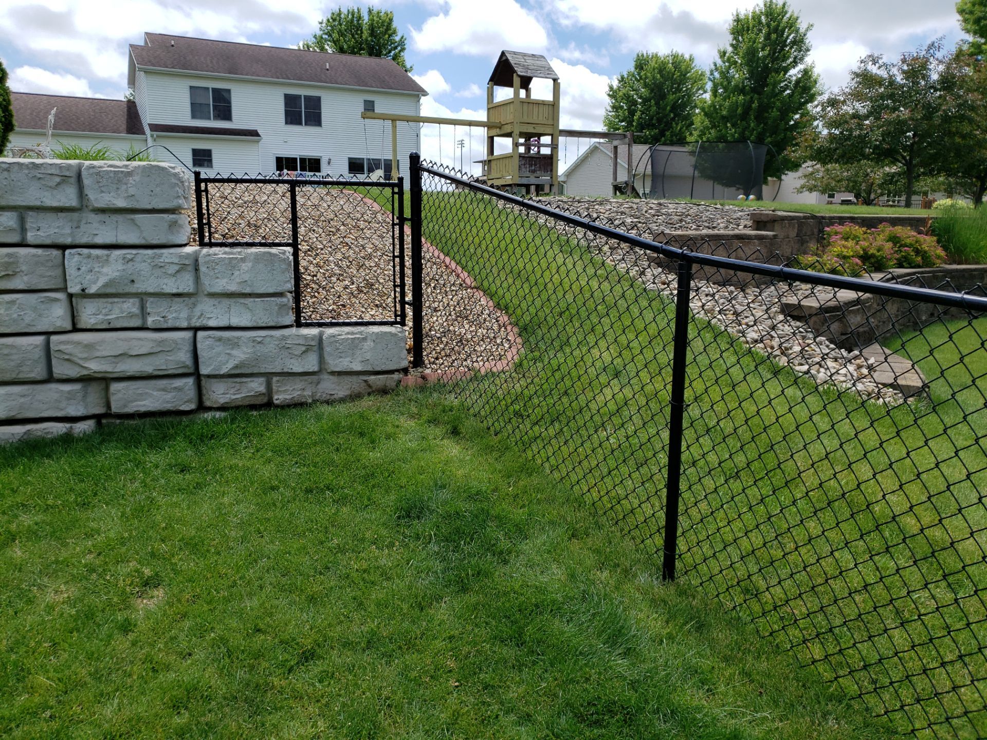 Black Vinyl-Coated Chain Link Fence Installation in Denver by Perfect Picket Fence and Stain