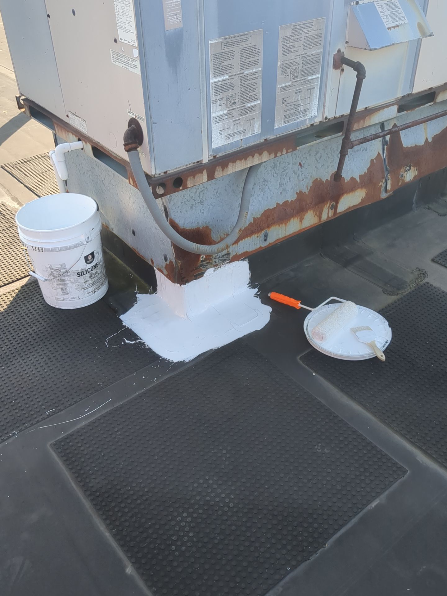 Commercial Roofing Repair using UniFlex Silicone Roof Coating on KinderCare Learning Center by 3 Daughters Construction 