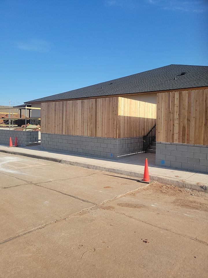 Cedar Fence using Cedar Pickets and Metal Poles by Clays Services Inc