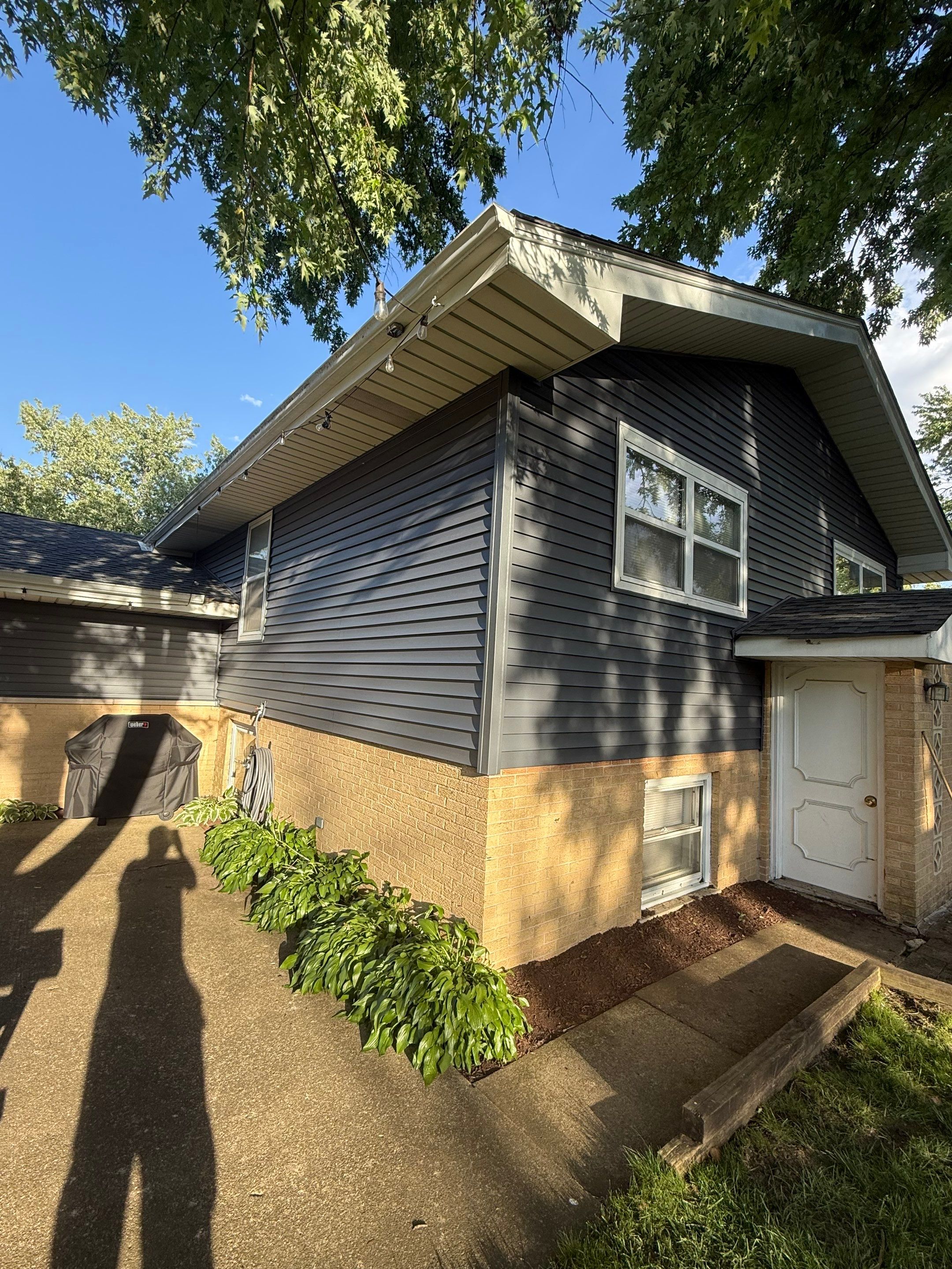 Roof replacement and chimney flashing by Optimal Home Improvement 