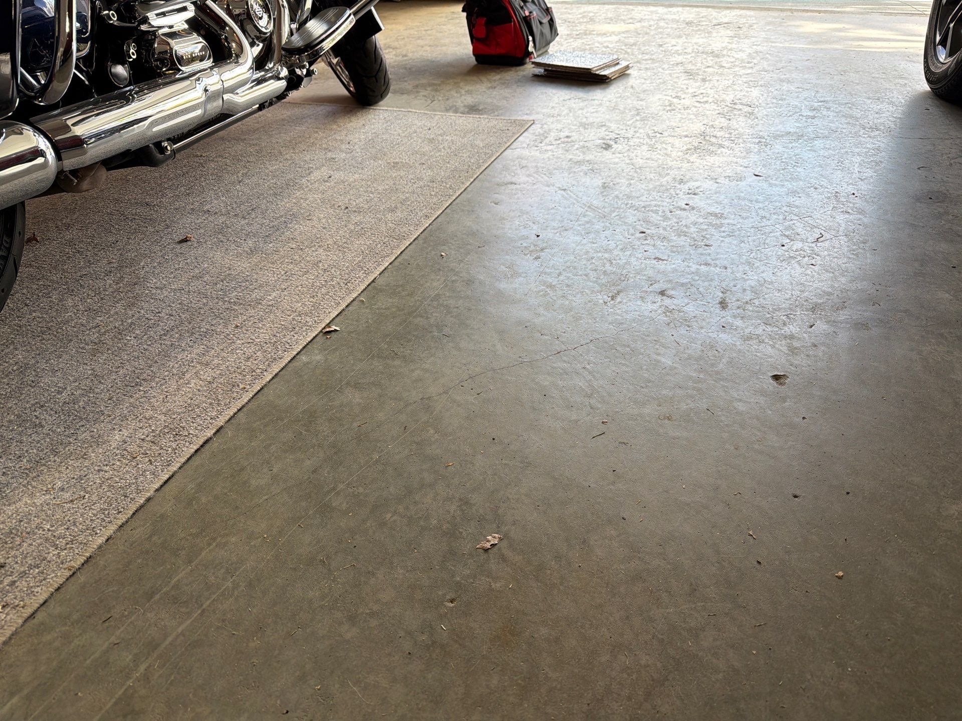 Residential Garage Floor Coating with Feather Grey Finish in Sioux Falls by Select Painting, Coatings & Garage Cabinets