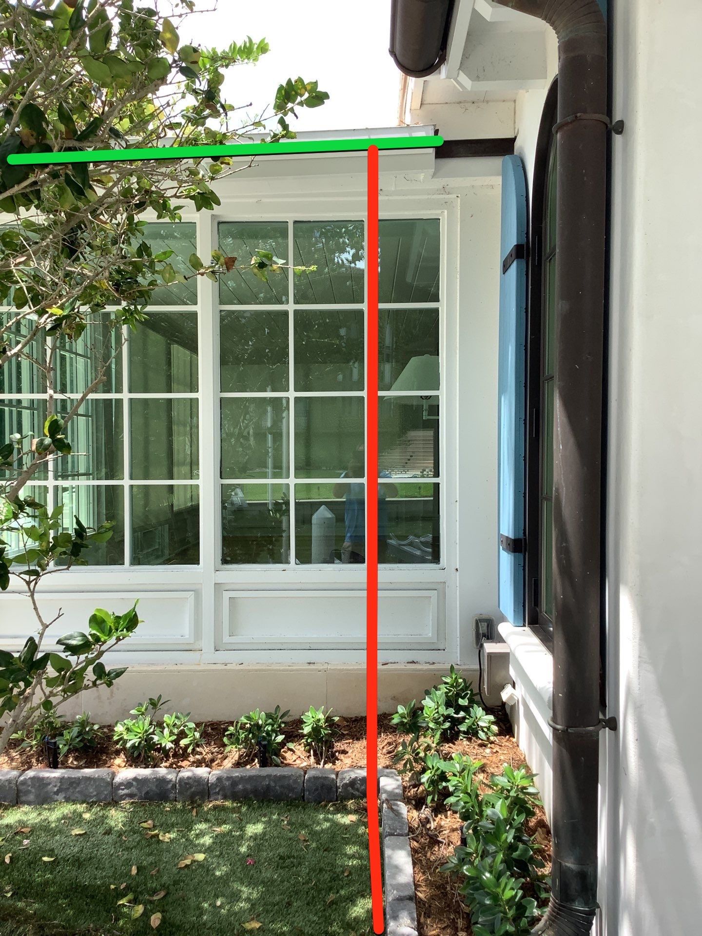 Seamless aluminum gutter installation in Sarasota, FL using 3x4 elbow downspouts combined with round downspouts by Gutter Professors