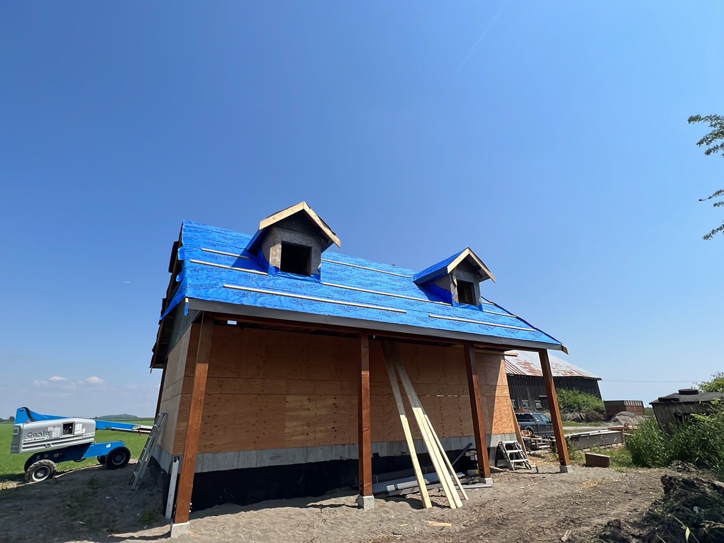 Agricultural Roofing Installation using 12" Prolok metal  by Top Notch Roofing Inc