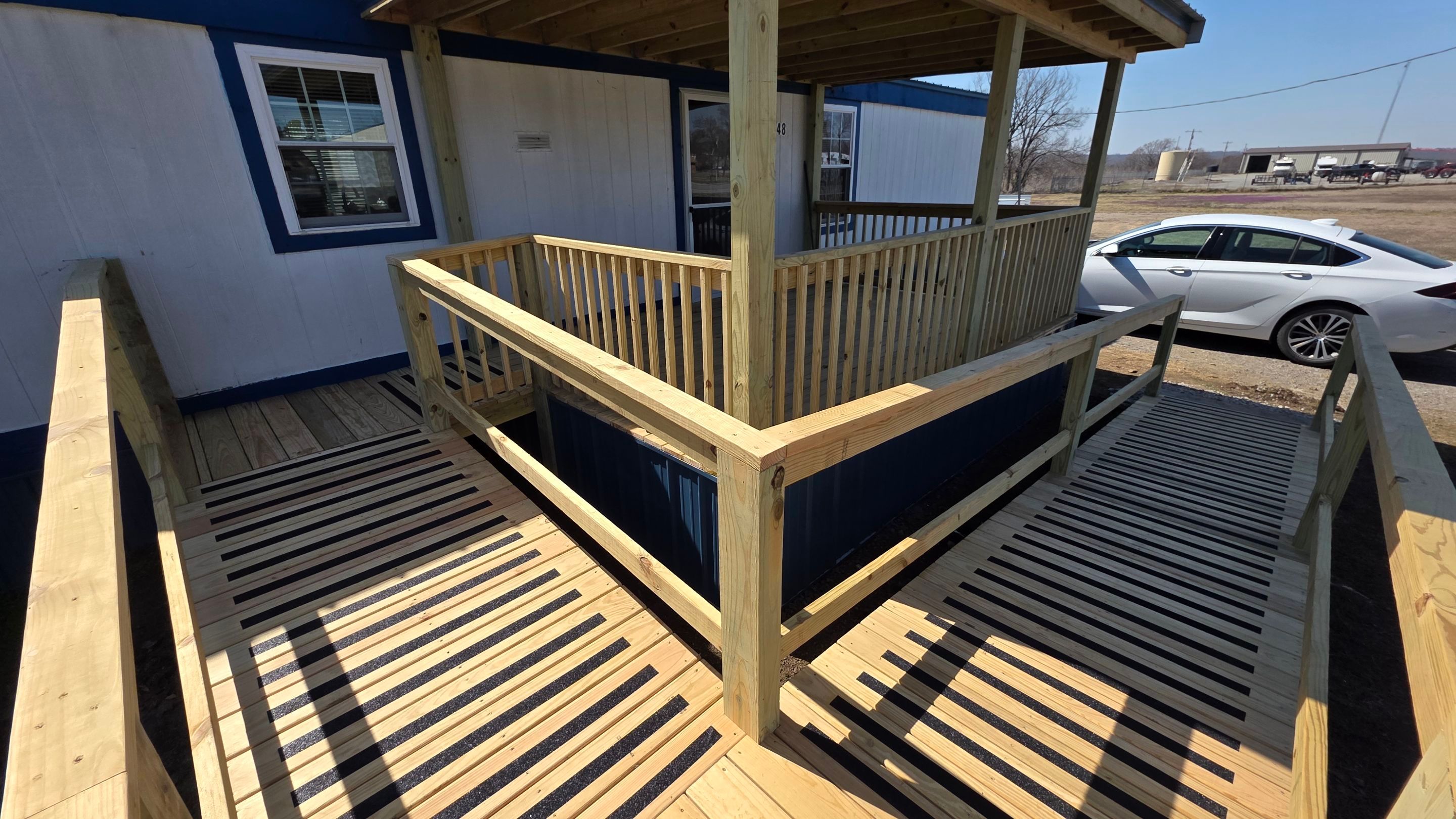 Covered Deck w/ ADA Ramp by In & Out Construction & Remodeling, LLC