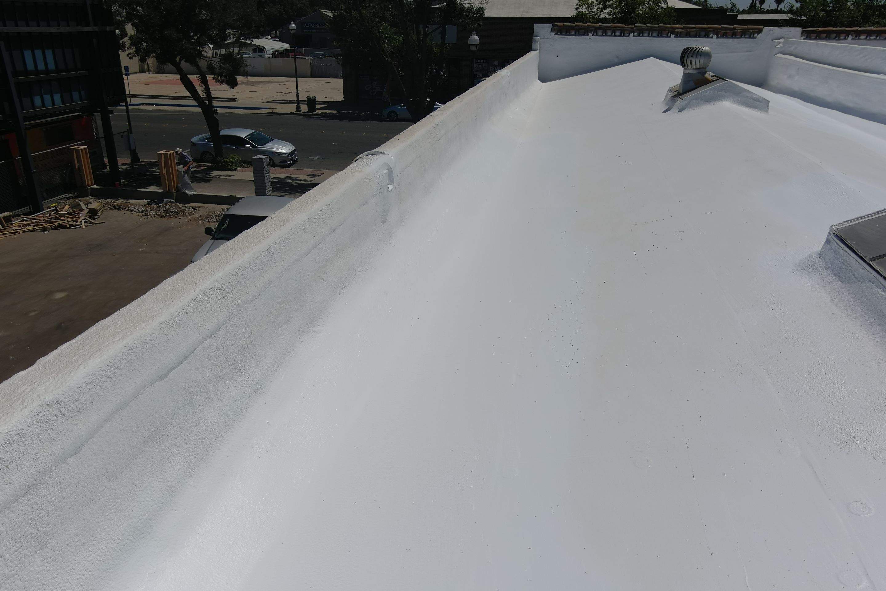 Commercial Roofing Installation using Conklin BenchPly system with PUMA top coat (imbedded fabric system) by Straight Edge Roofing Inc