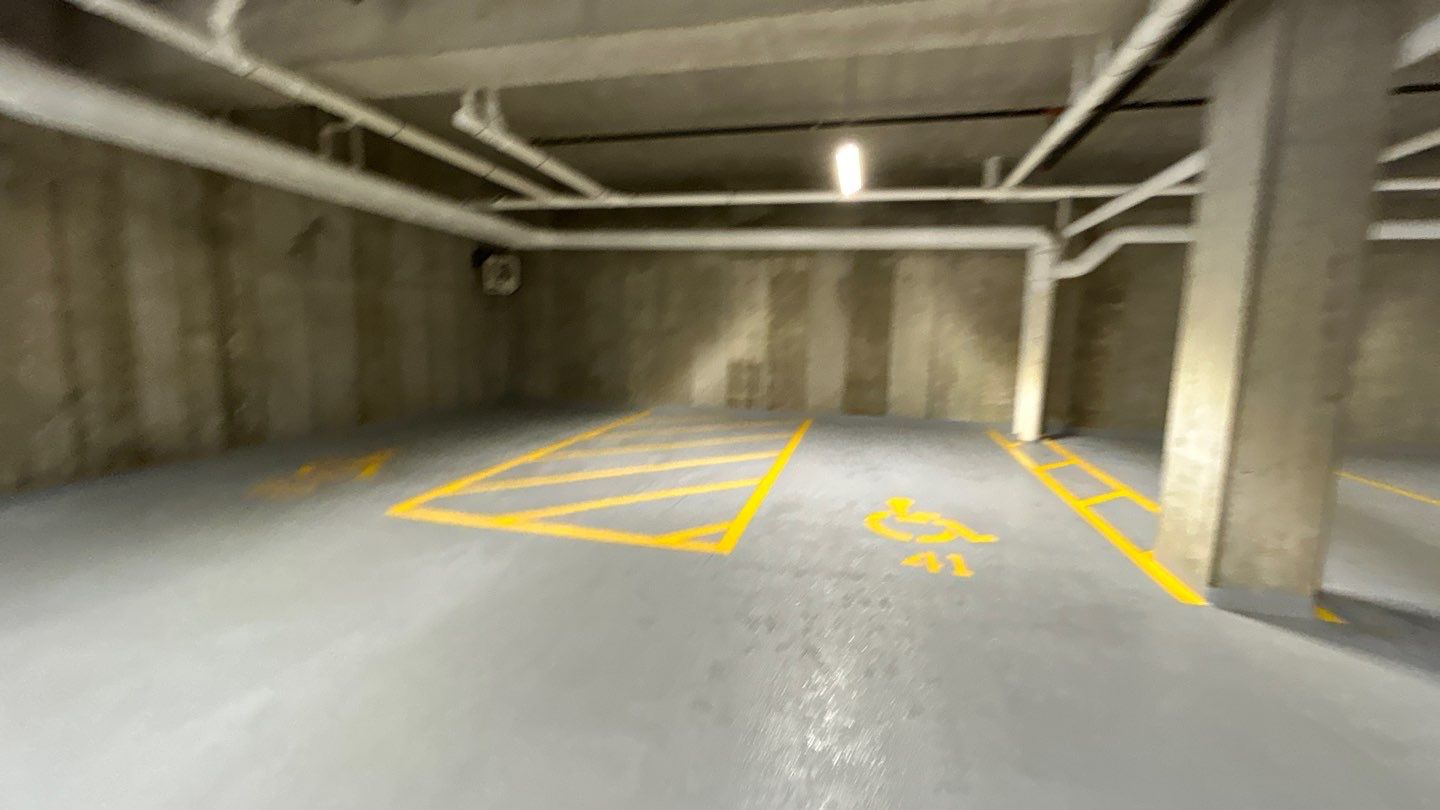 Parking garage using Hot water by Northern Power Washing LLC.