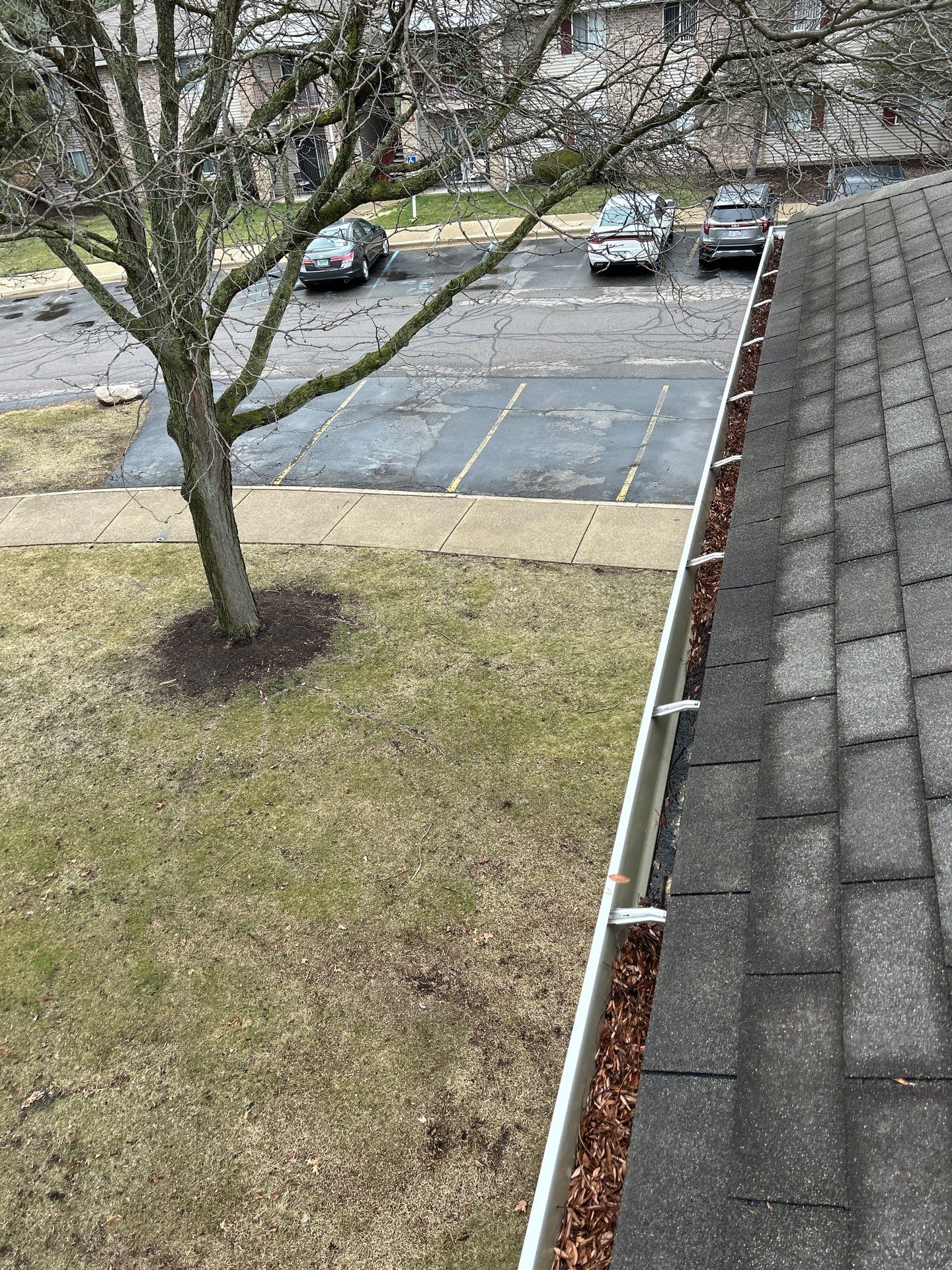 Commercial gutter cleaning Westland, MI before photo with filled gutters
