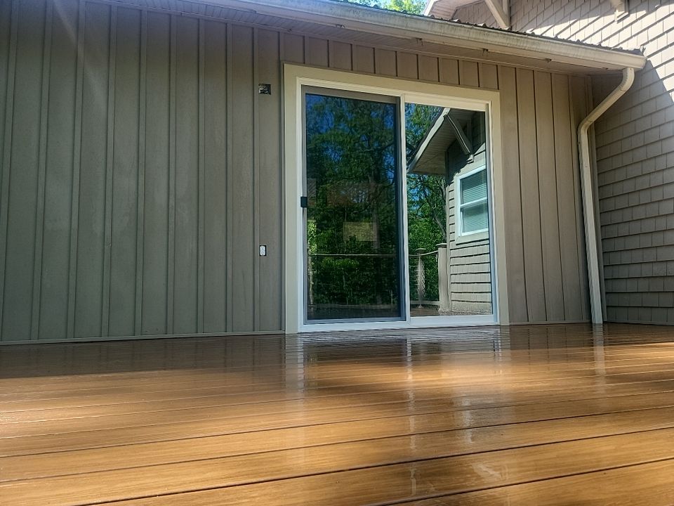 Deck installation using cable railing. by Burke Home Services