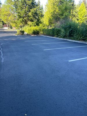 Kidder Matthews | Parking Lot Sealcoating & Striping with Concrete Curb & Patch Repairs