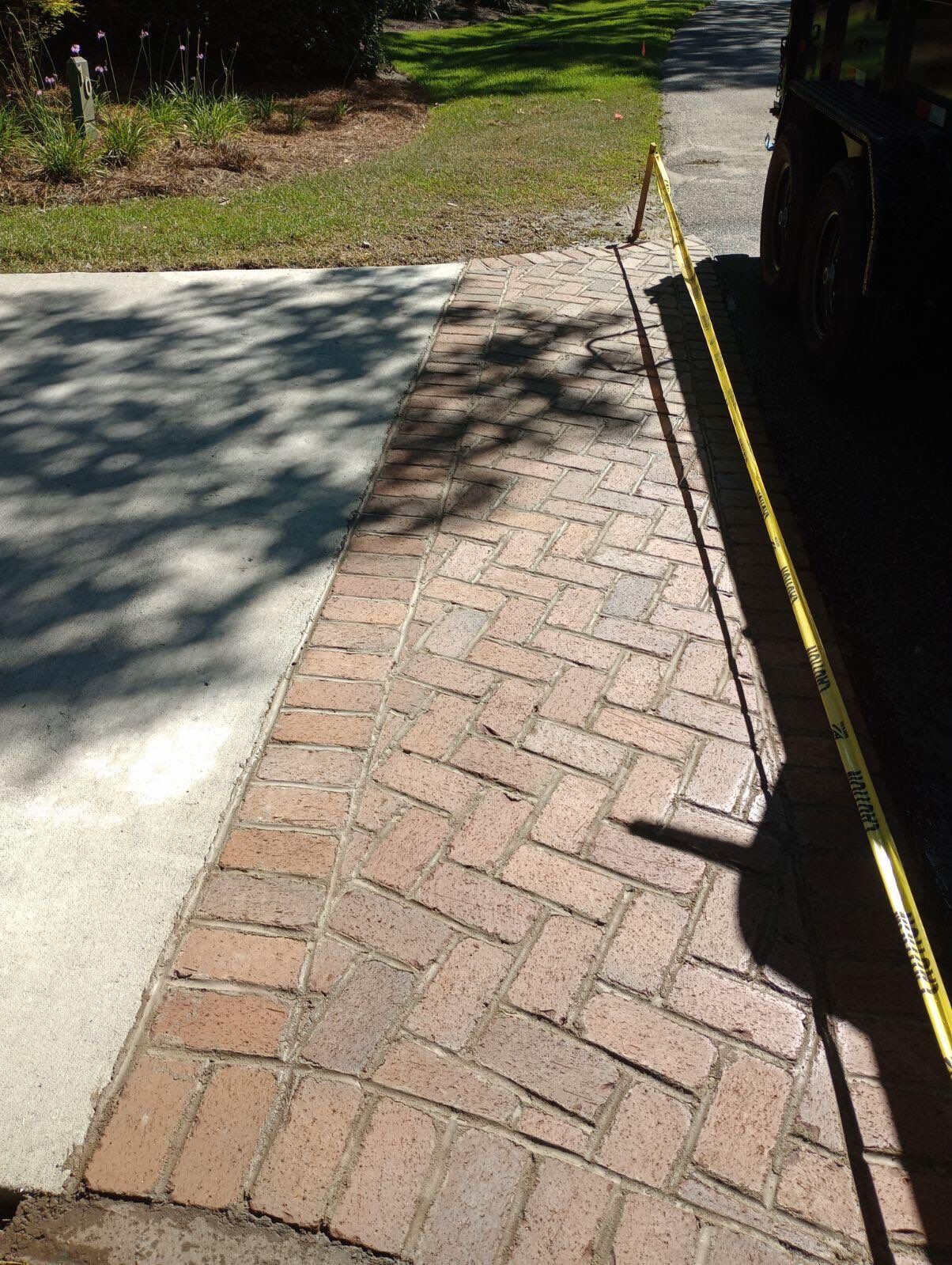 Hilton Head Island Concrete Driveway Replacement with Herringbone Brick Inlays by Lowcountry Scapes, LLC