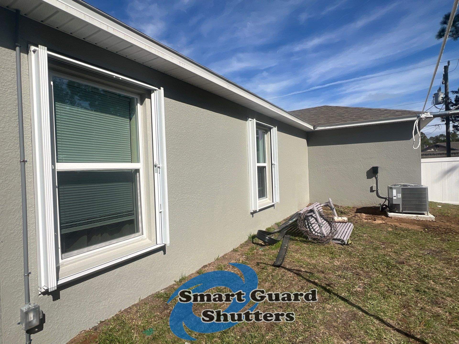 Accordion Shutters in White by Smart Guard Shutters