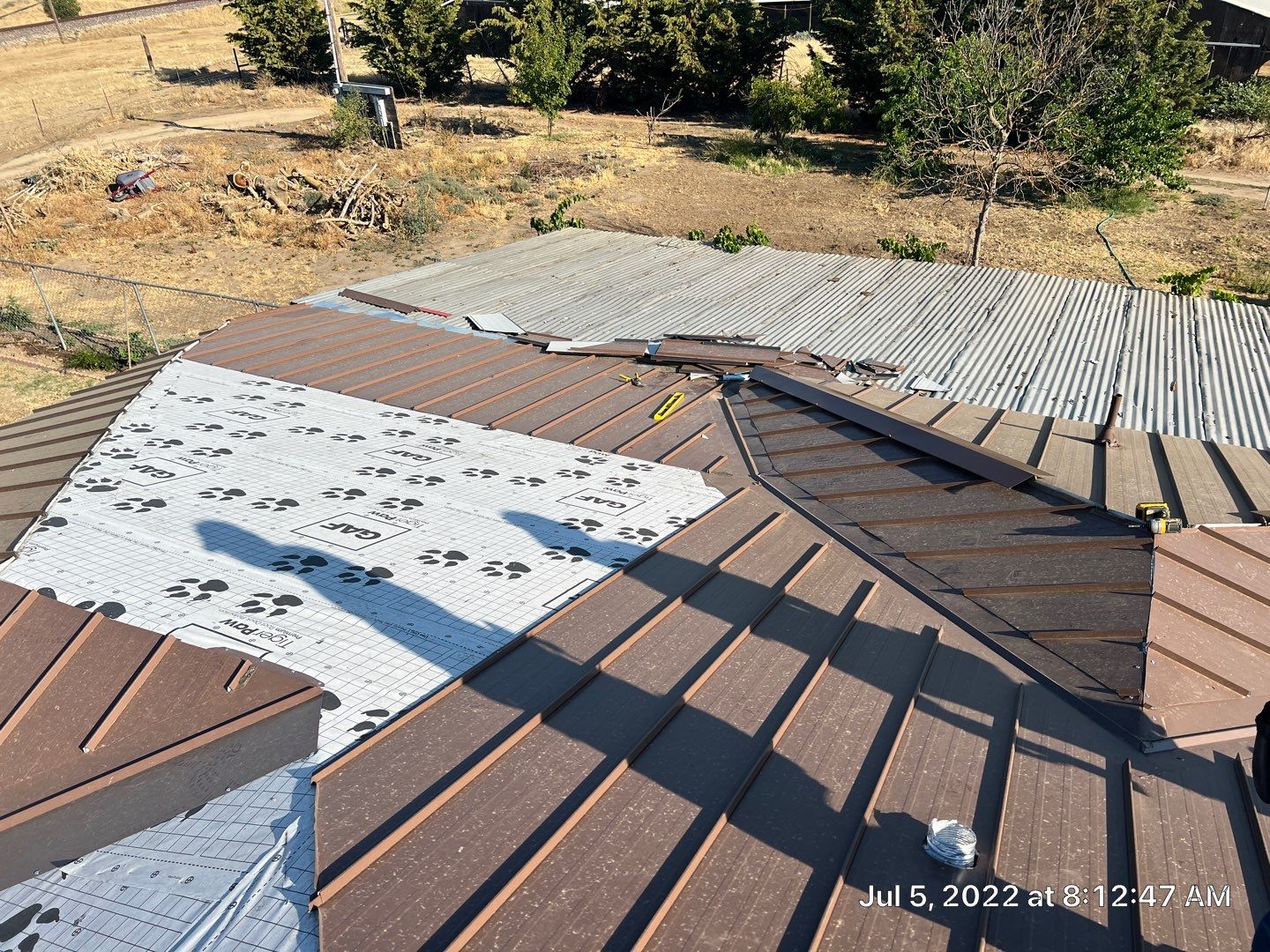 Metal roofing installation using Standing seam metal roofing system by Straight Edge Roofing Inc