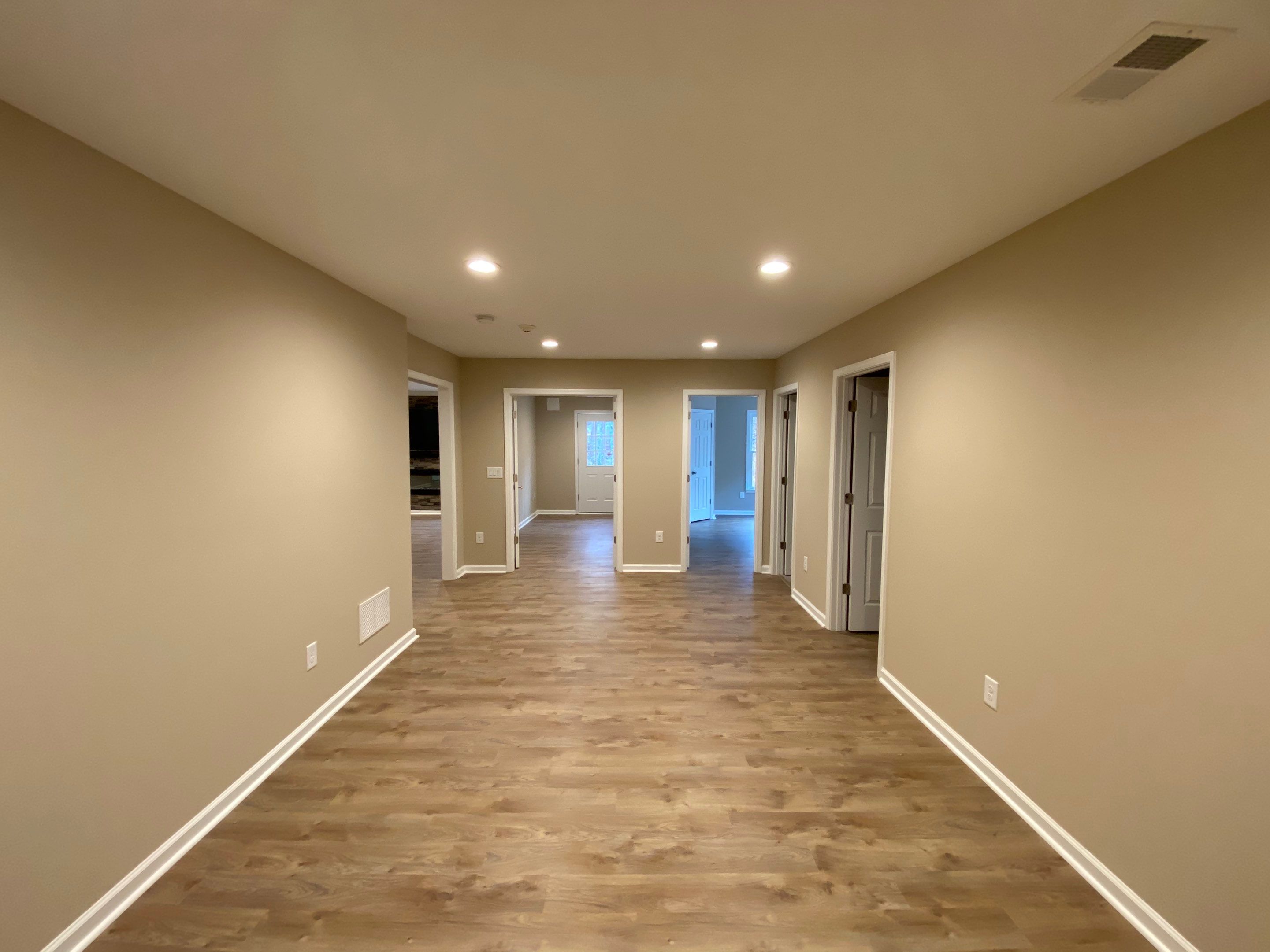 Acworth Basement Transformation With Wet Bar and Stone Fireplace by Swift Home Renovations