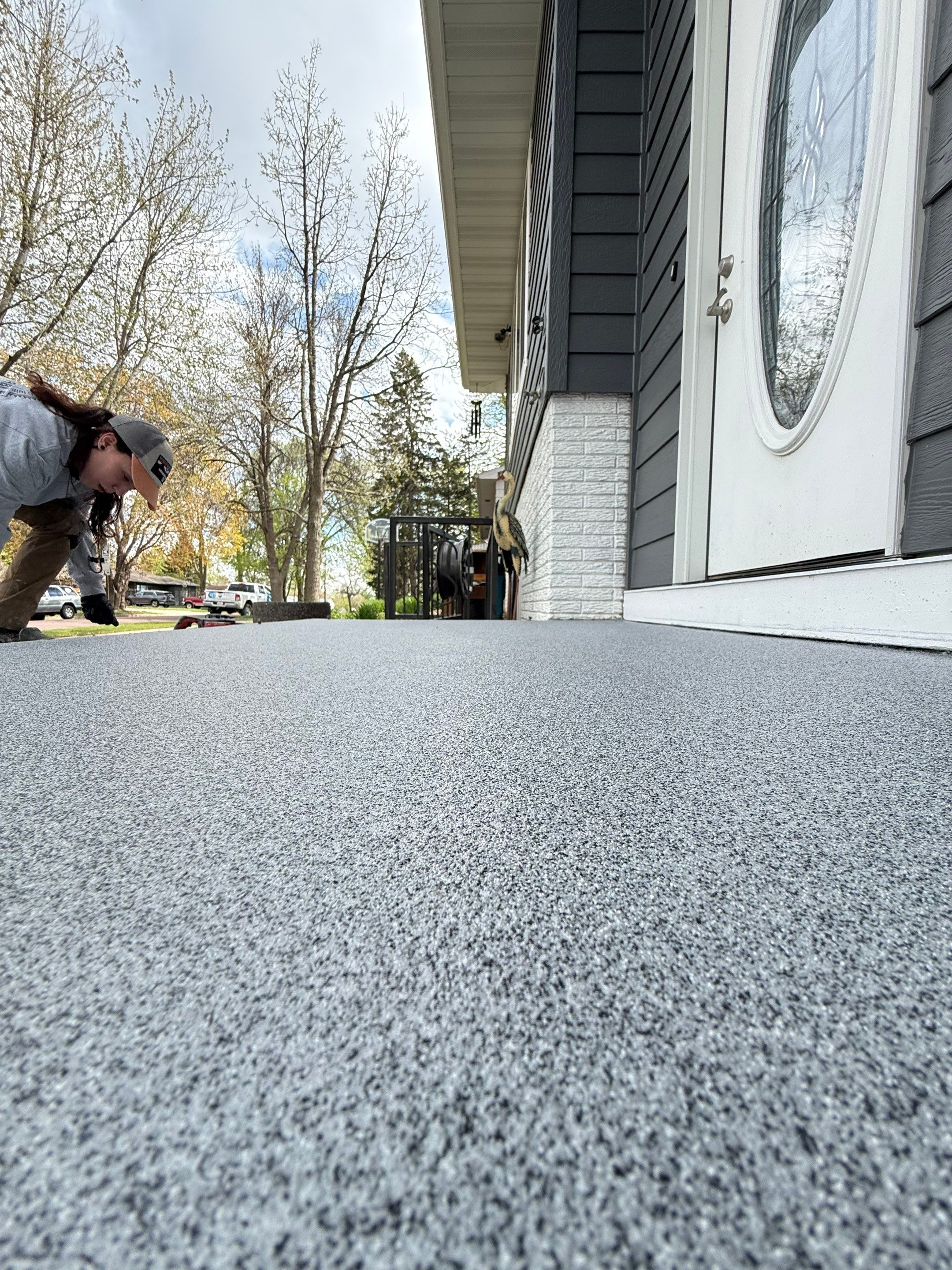 Grey Polyaspartic Porch and Stair Resurfacing in Sioux Falls by Select Painting, Coatings & Garage Cabinets