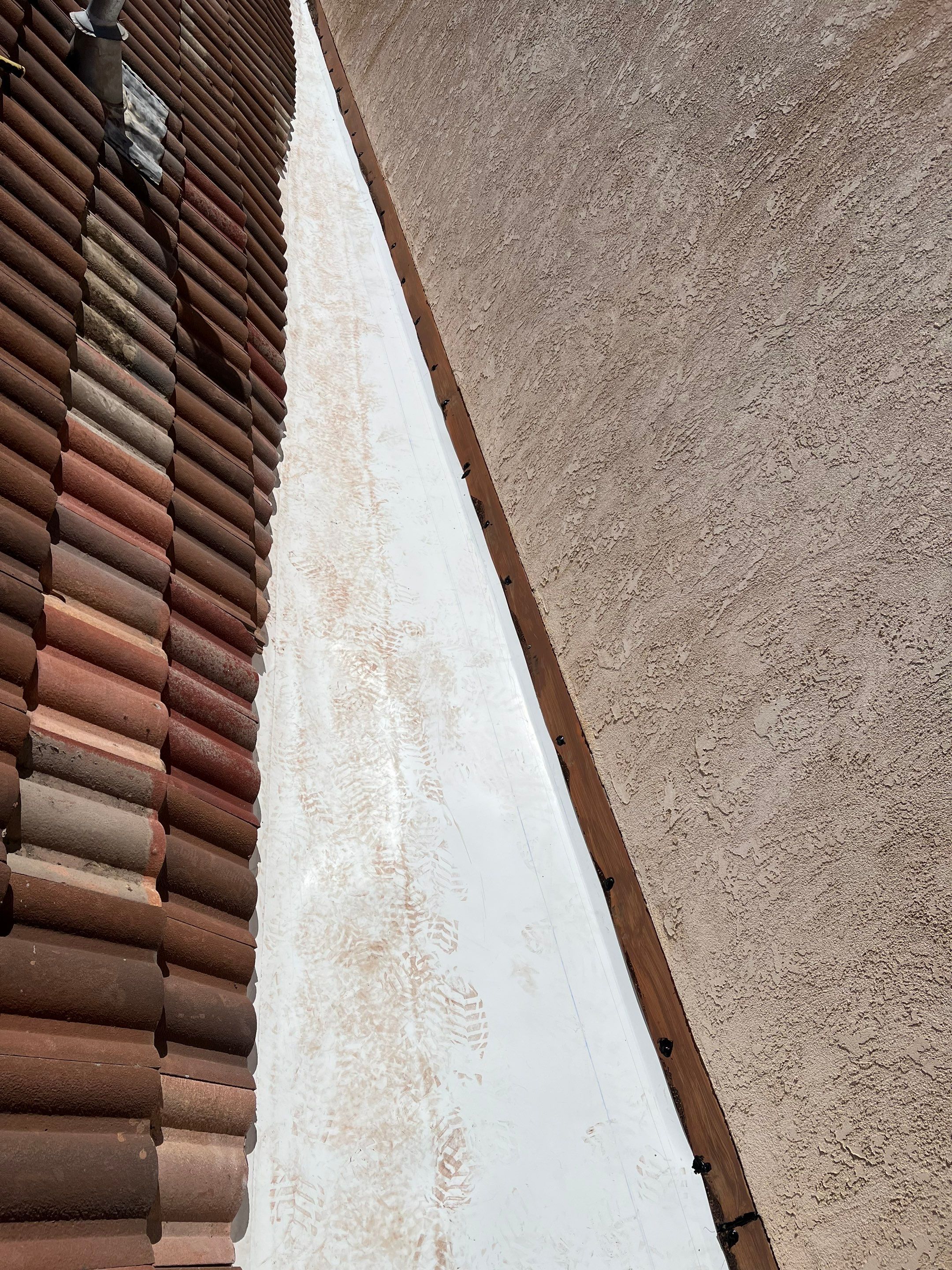 Tile Roof repair by Grandmark Service Company