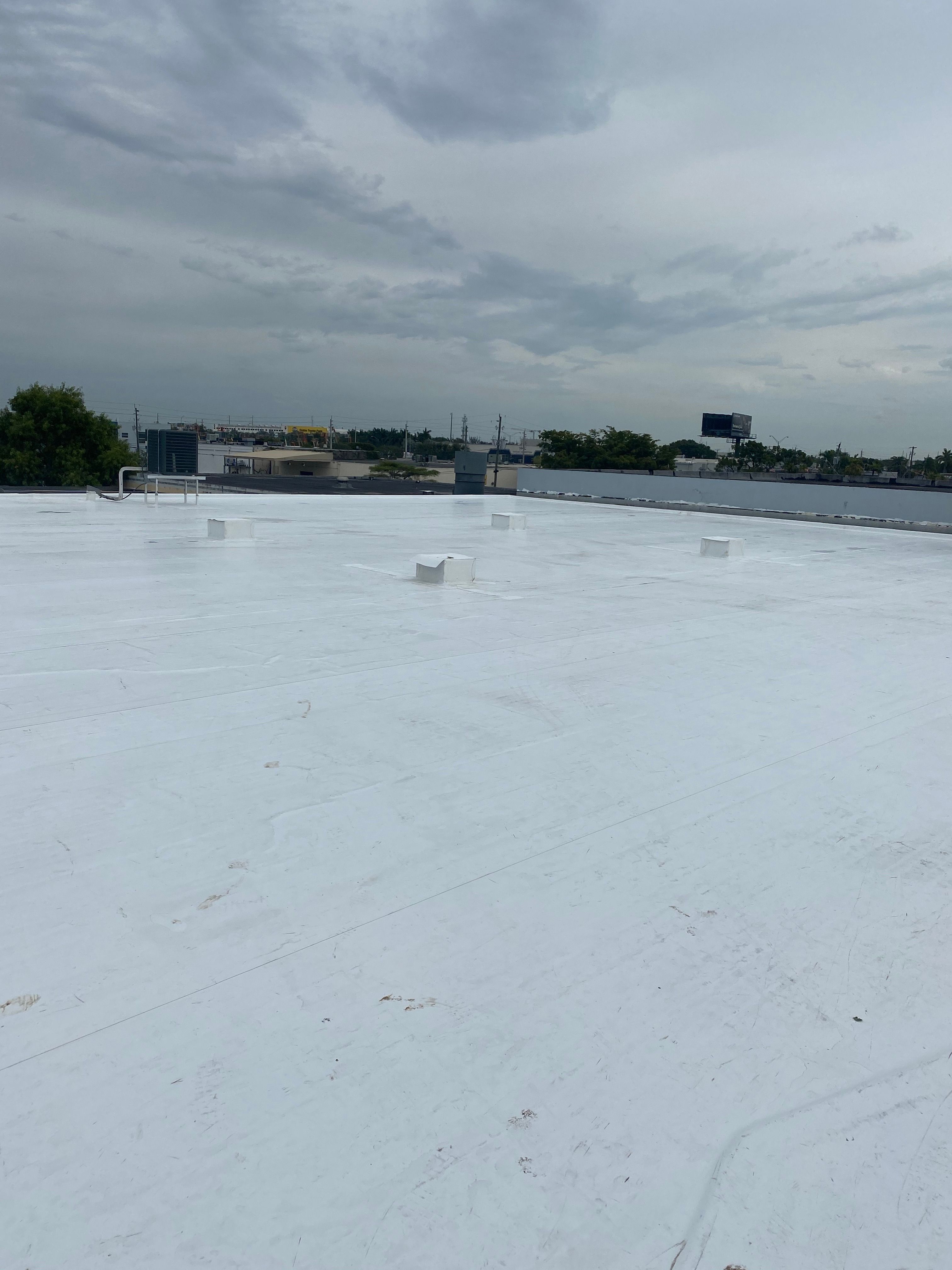 Commercial TPO Flat Roof Installation for Doral Industrial Building by AJF ROOFING INC