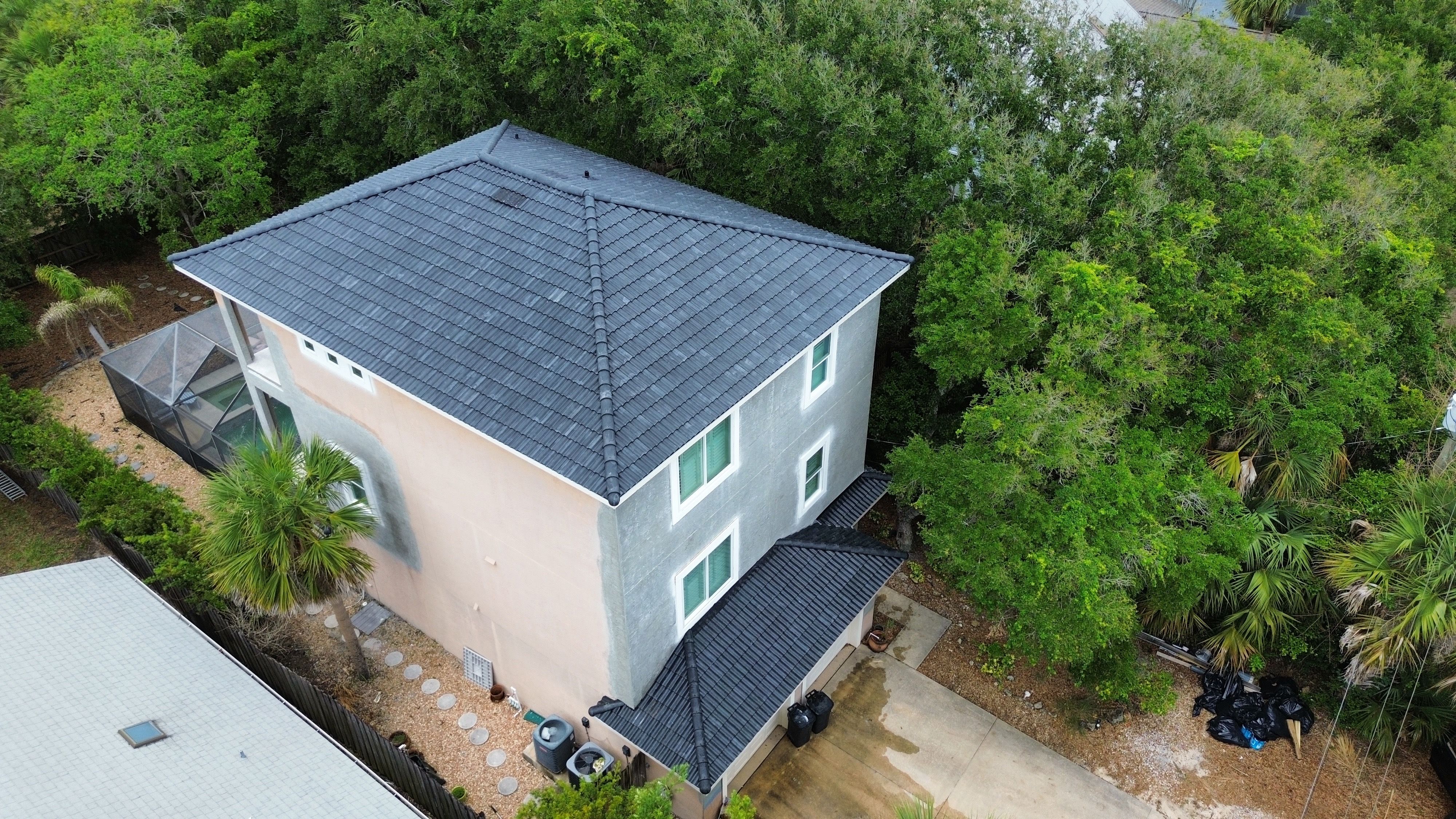 Flagler Beach Residential Tile Roof Replacement with Dark Barrel Tiles by Fortified Roofing Solutions Corp.